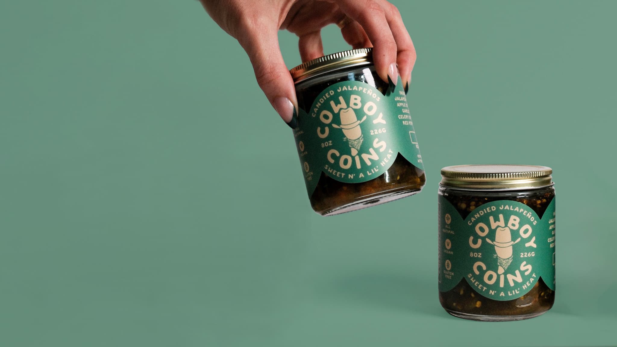 Cowboy Coins jars on green background